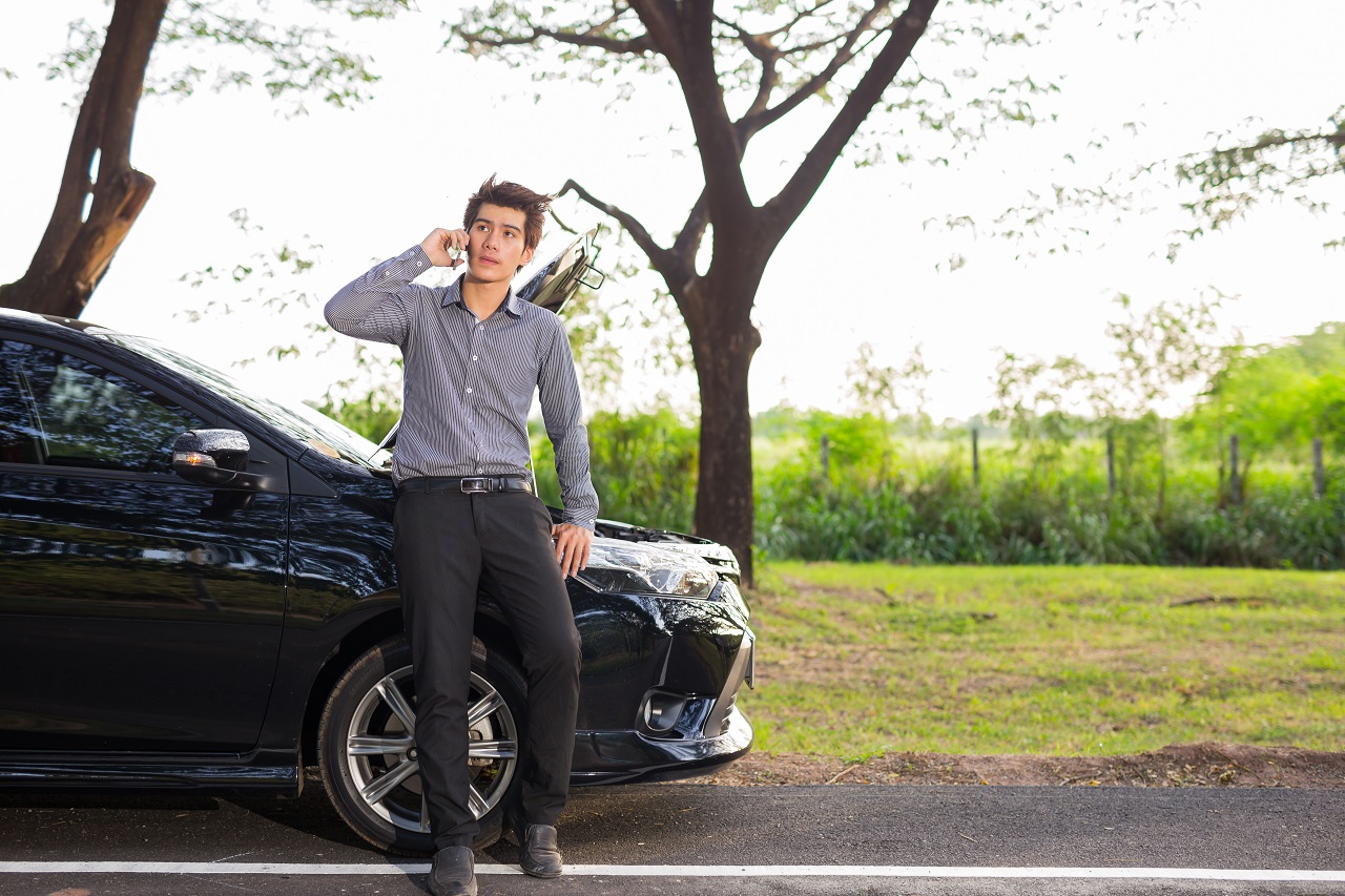 Man Calling On Towing Company During A Breakdown Man Calling On Towing Company During A Breakdown